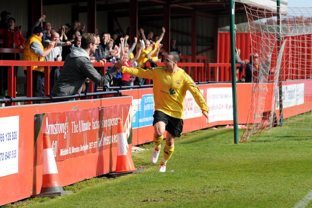 Ryan Mallon celebrates his goal with Worksop Town fans during exile at Ilkeston's New Manor Ground.