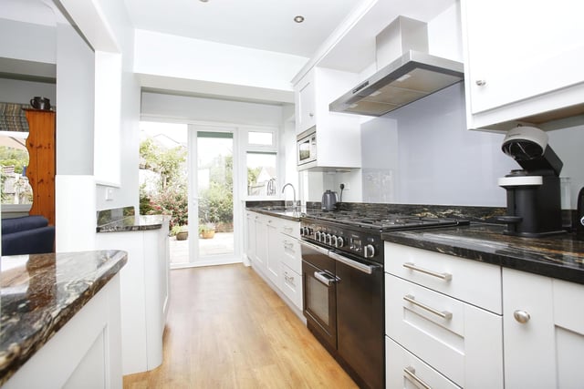 The home offers a modern fitted kitchen with french windows that open out onto the back garden patio