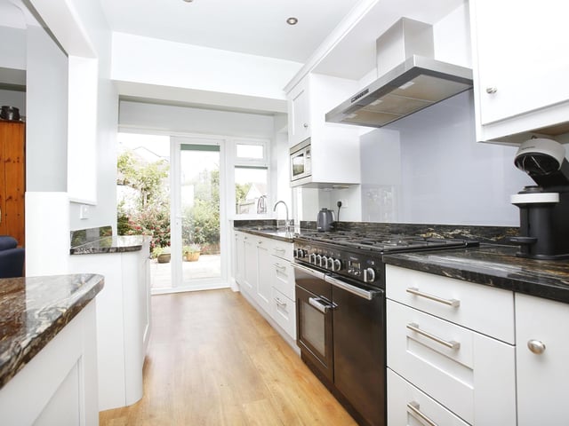 The home offers a modern fitted kitchen with french windows that open out onto the back garden patio