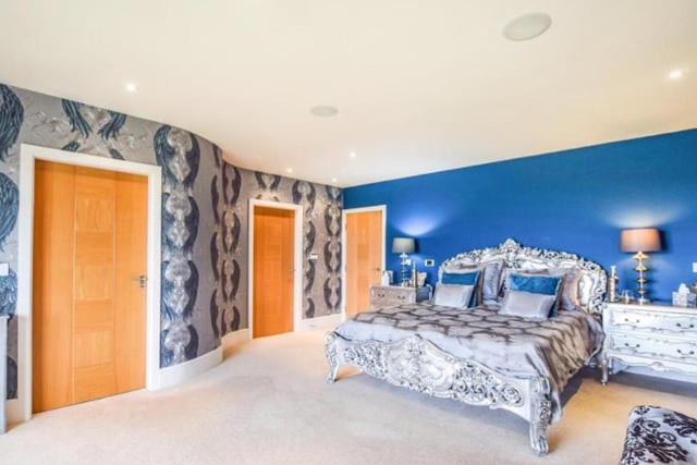 The impressive master bedroom benefits from an en-suite and a walk-in wardrobe.