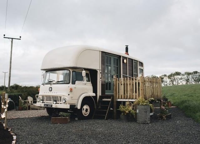 From £120 per night, this luxurious, vintage-styled former horse box for two is beautifully secluded amongst private, hen-dotted farmland close to Ireland's North Coast.