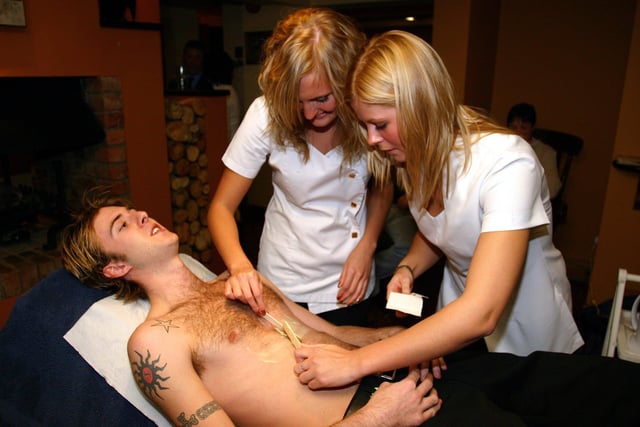 Charity event at The Eden Arms pub in Doncaster in  2004 - the team raised an amazing £1500 on the night for the Laura Crane Trust. Team member endures chest hair removal all in the name of charity!