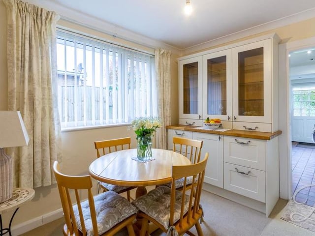 Just off the kitchen is this handy breakfast room. It has a carpeted floor, central-heating radiator and window to the back.