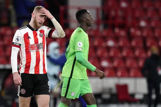 A dejected Oli McBurnie of Sheffield United looks on at the final whistle against Chelsea: Andrew Yates/Sportimage