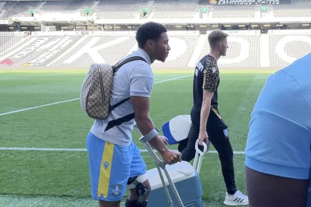 Sheffield Wednesday's Akin Famewo left on crutches after the Owls beat MK Dons.