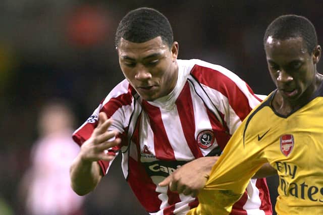 Sheffield United vs Arsenal - Colin Kazim-Richards gets to grips with Kolo Toure