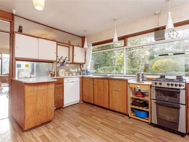 The kitchen is fitted with a range of base and wall storage units but has lots of scope for remodelling