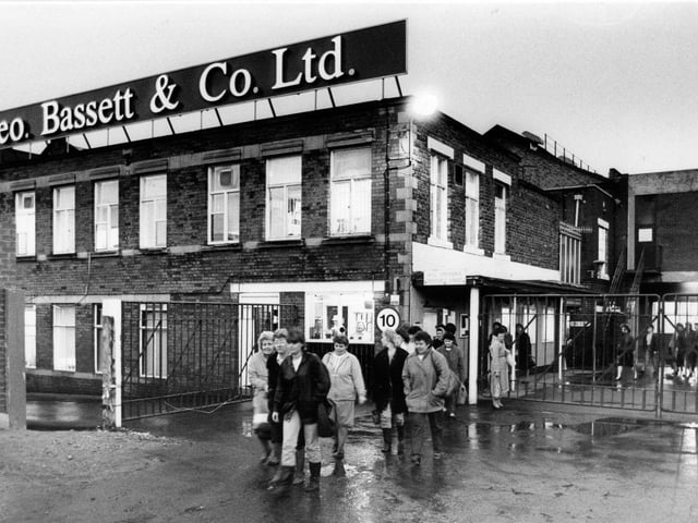 Workers leave the factory at the end of a shift at George Bassett & Co in 1989