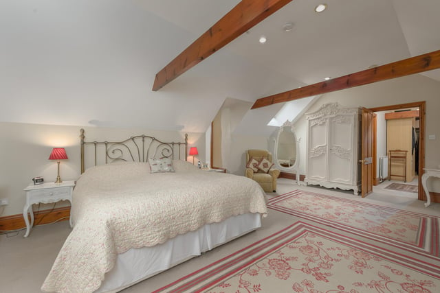 There are three further double bedrooms all offering views across open countryside, a luxury appointed family bathroom with a four piece suite.