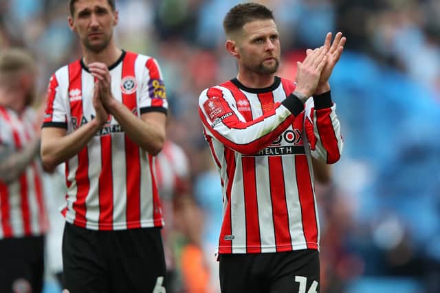 Sheffield United midfielder Oliver Norwood with another of the club's most experienced players Chris Basham (left): Paul Thomas / Sportimage