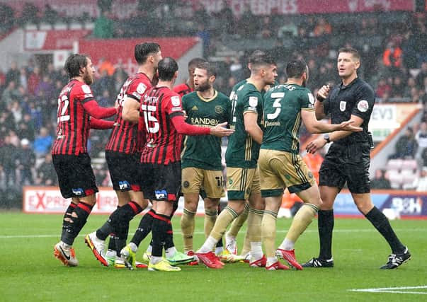 Bournemouth and Sheffield United players speak to the referee Rob Jones after a penalty kick is awarded to Bournemouth: Adam Davy/PA Wire.