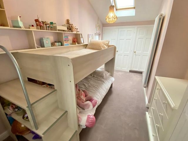Another of the four bedrooms, which could easily be turned into an office, if required. It boasts a double cupboard and shelves.
