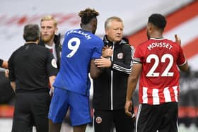 SHEFFIELD, ENGLAND - JULY 11: Tammy Abraham of Chelsea and Chris Wilder, the manager of Sheffield United, embrace following the Premier League match between Sheffield United and Chelsea FC at Bramall Lane on July 11, 2020: Peter Powell/Pool via Getty Images