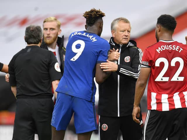 SHEFFIELD, ENGLAND - JULY 11: Tammy Abraham of Chelsea and Chris Wilder, the manager of Sheffield United, embrace following the Premier League match between Sheffield United and Chelsea FC at Bramall Lane on July 11, 2020: Peter Powell/Pool via Getty Images
