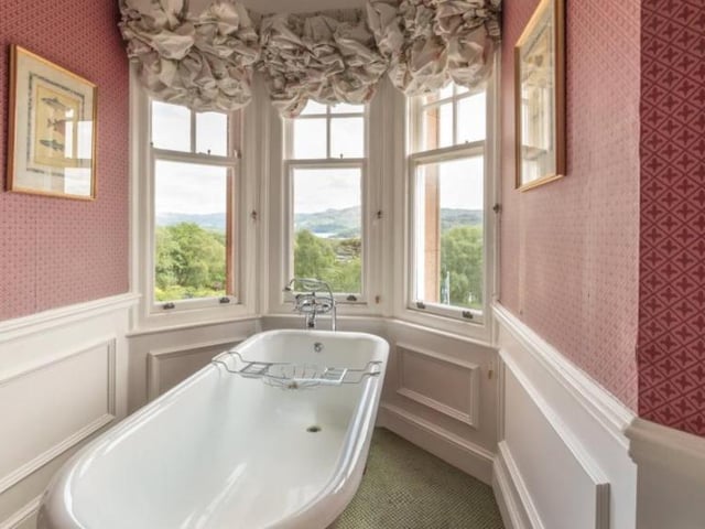 There are no shortages of bathrooms in the castle either, boasting wonderful standing bathtubs and views onto the expansive grounds