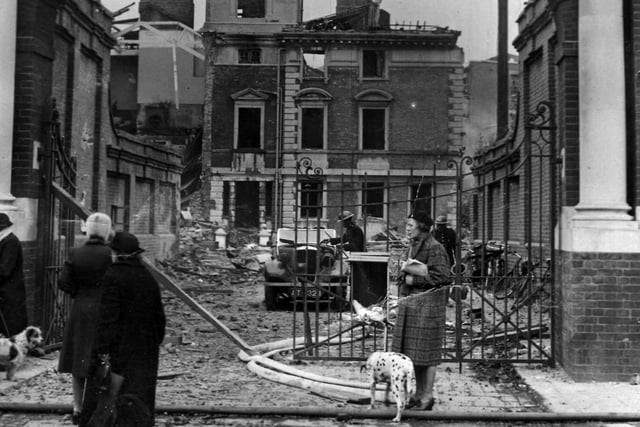 Kate Bryant with her Dalmatian Dinah waiting outside the bomb-ravaged Royal Hospital, Portsmouth, in April 1941