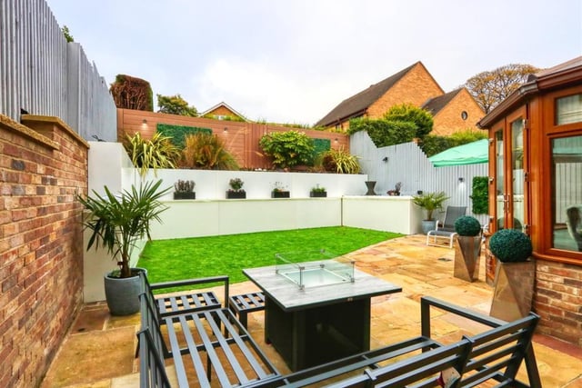 The patio in the rear garden provides a great place for entertaining on a warm day.
