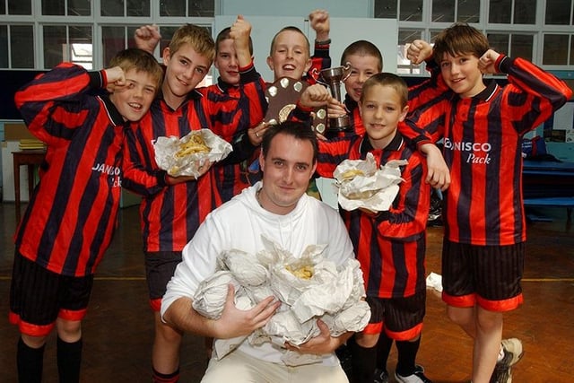 Greystones Primary School teacher Paul Moohan provides his "Red" soccer team with chips after losing a bet they couldn't go all season unbeaten (July 2004)