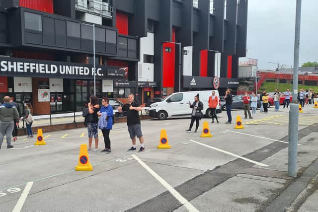 People waiting outside for SUFC Covid pop-up.