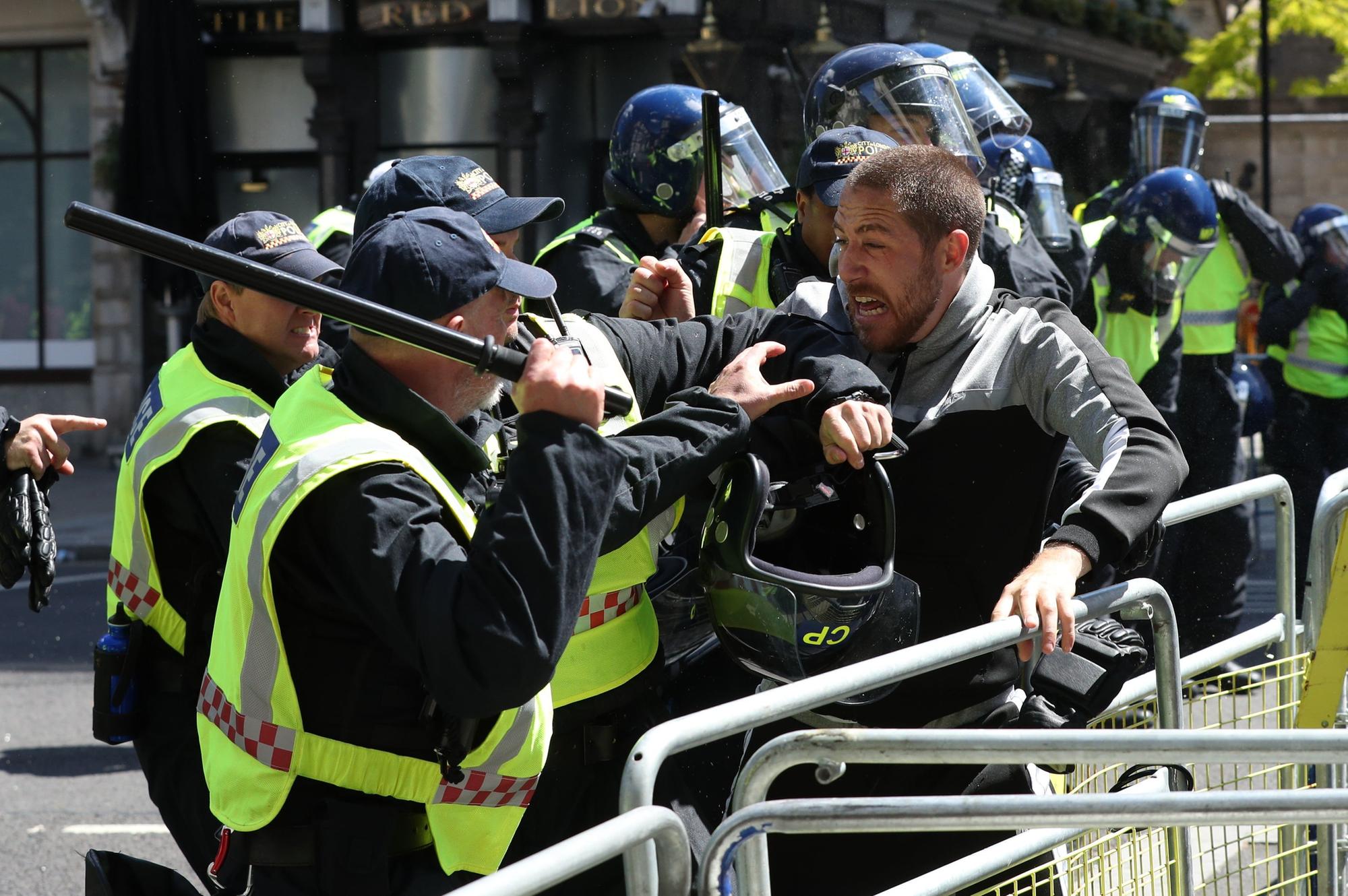 Police are confronted by protesters in Whitehall near Parliament Square. Jonathan Brady/PA Wire