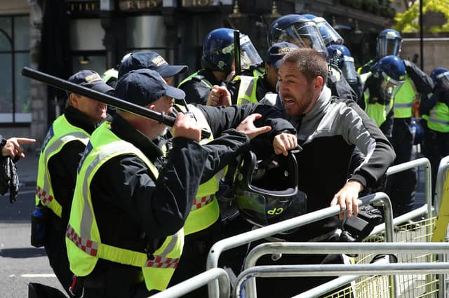 Police are confronted by protesters in Whitehall near Parliament Square. Jonathan Brady/PA Wire