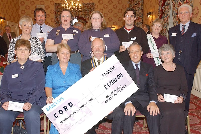 Fred Calvert, President of Amble and Warkworth Rotary Club, at the presentation of cheques in May 2004.