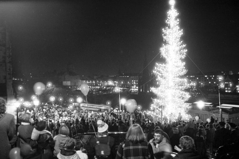 Crowds at The Mound in Edinburgh watch the Christmas tree lights switched on November 1989.