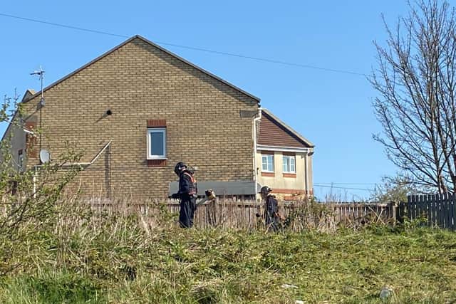 Police search teams are on the Manor estate in Sheffield today looking at areas of open land and in drains (Photo: Dan Hayes)