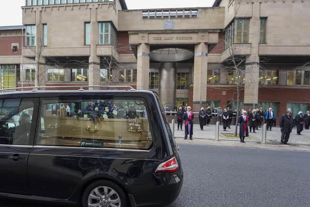 Judges, court officials and staff pay their respects to long standing 'court watcher' Andrew Mollison as his funeral cortege passes  Sheffield Crown Court. Picture Scott Merrylees