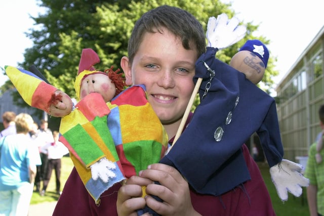 Dale O'Driscoll, aged 12 with his creations he made at Bircotes and Harworth Community Summer School in 2000