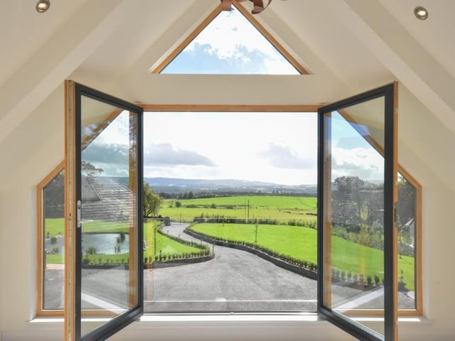 This house is on the market for offers over £1,700,000. It was completed in 2019, has seven bedrooms and uninterrupted views over Loch Lomond.