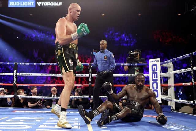 Tyson Fury knocks down Deontay Wilder in the fifth round during their heavweigh title bout. (Photo by Al Bello/Getty Images)