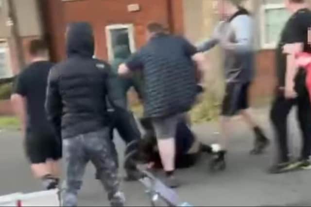 Four people have been arrested after violence broke out between neighbours in the middle of a Sheffield street.