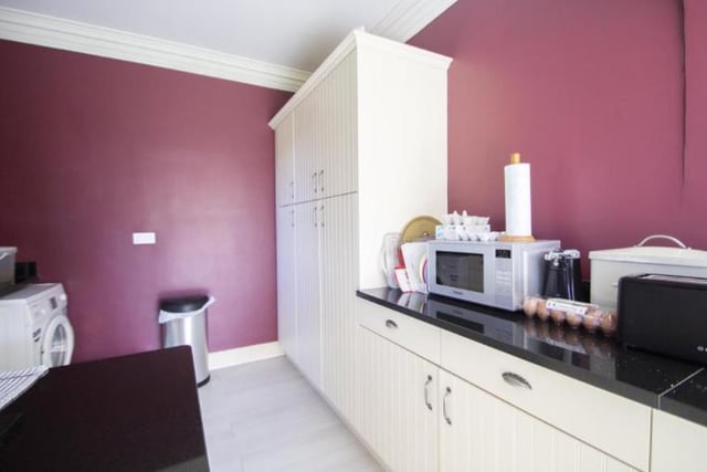 Just off the kitchen, the property includes a generously sized utility room.