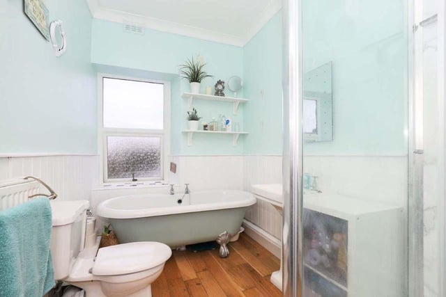 The family bathroom features a stand alone bath walk-in shower.