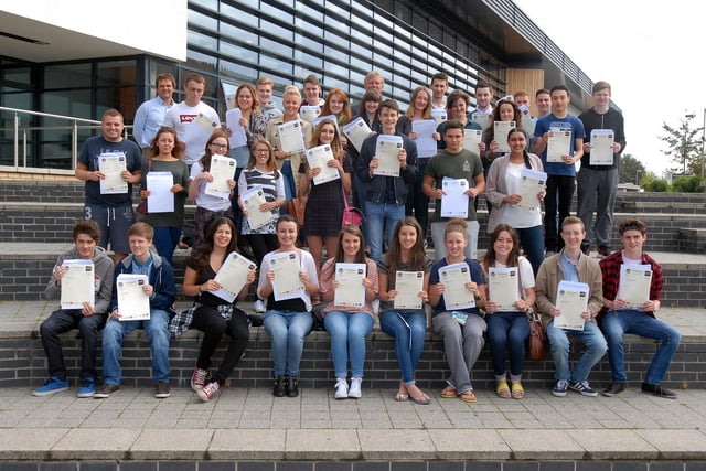 A-level students with their certificates in 2014.