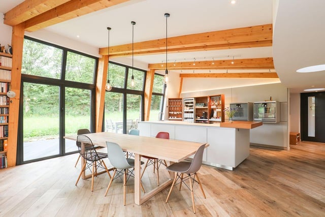 The floor to ceiling windows allow natural light to flood into the living space.