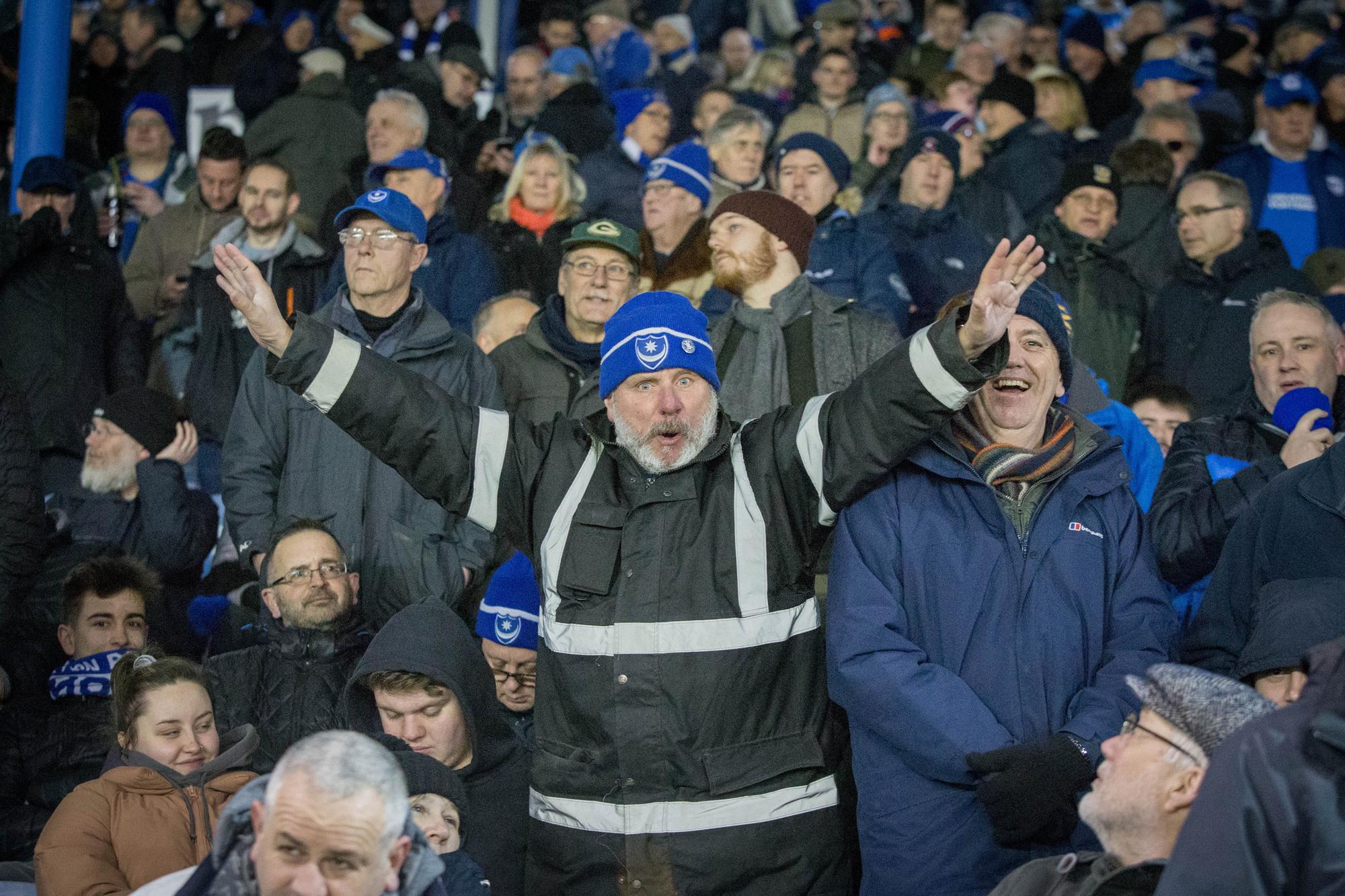 Pompey fans enthusiastically cheering on their side at Fratton Park.