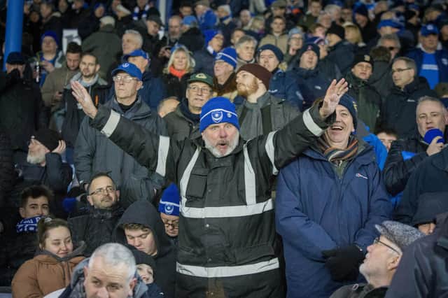 Pompey fans enthusiastically cheering on their side at Fratton Park.