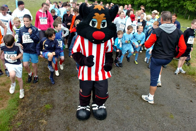 The start of the Lambton family fun run in 2012 and Samson is keen to get everyone warmed up for the race.