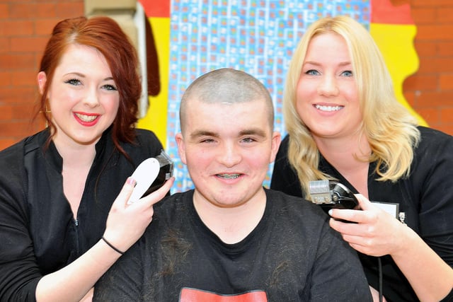 Hartlepool Sixth Form College student Ricky Adams pictured after getting his head shaved by Shannon Cummings (left) and Rachel Hodgman 8 years ago..