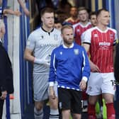 Barry Bannan leads out Sheffield Wednesday against Cheltenham Town.