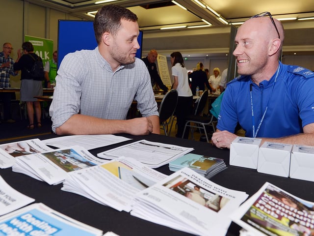 Mature and senior citizen fair at Mansfield civic centre. MP Ben Bradley with PCSO Tom Ford.