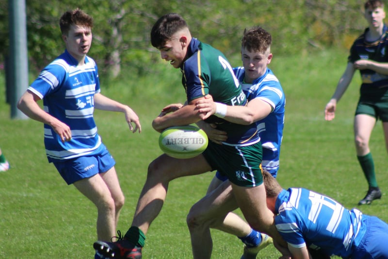Hawick Youth's Finlay Douglas being tackled by Jed Thistle captain Kieran Hayes