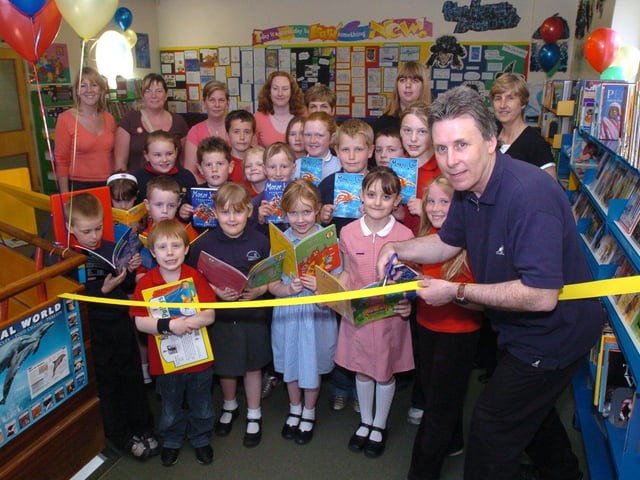 Author Peter Murry snips the ribbon on Ecclesfield Road's refurbished library., May 2005
