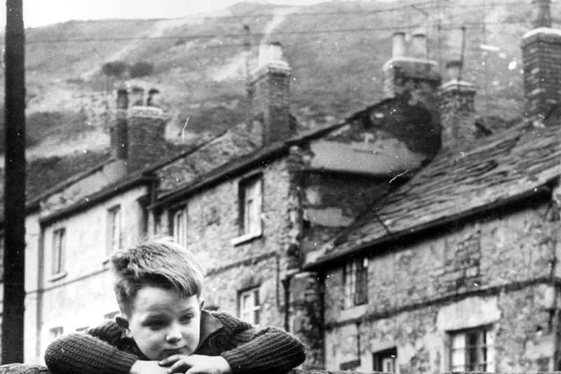 A child playing in an unidentified location within Sheffield, possibly Neepsend, during the early 1960s
