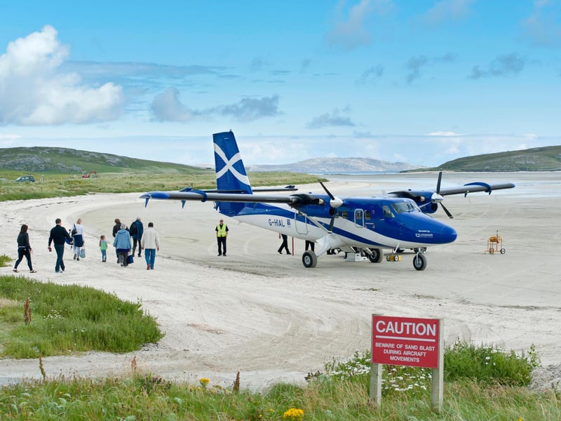 The vast expanse of firm golden sand at Traigh Mhor ("Big Strand") serves as Barra’s airport. It's a mile across at low tide, is big enough for three "runways" and is the only beach airport in the world that handles scheduled flights. Watching the little Twin Otter aircraft come and go is a popular spectator sport. In between flights, locals gather cockles, a local seafood speciality, from the sands.