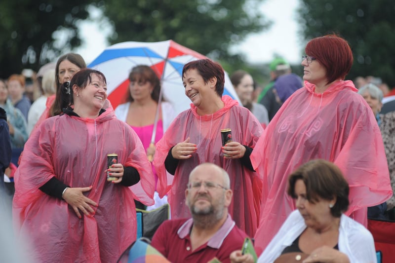 They may be soaked but they were still enjoying every minute of the concert. Can you spot someone you know?