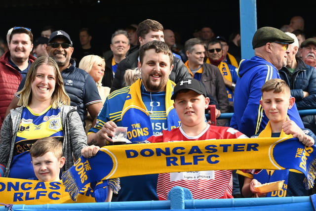 Dons fans proudly show their colours before the game.