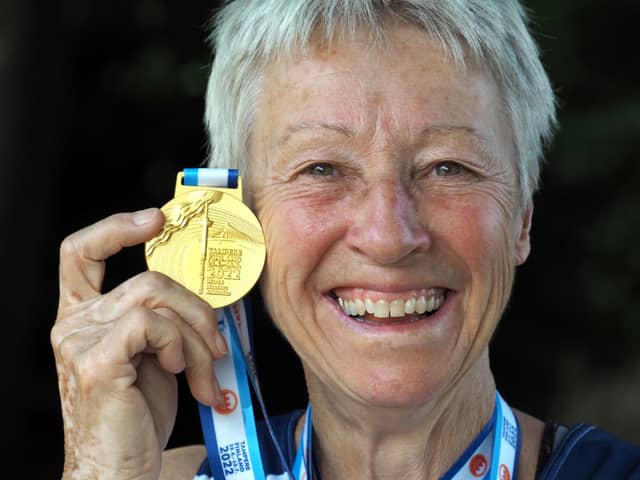World W70 10K Champion Dot Kesterton with her gold medal.